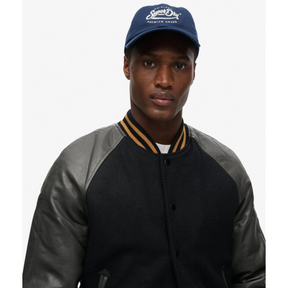 Close-up front view of black varsity jacket with leather sleeves