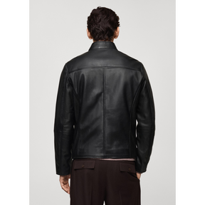 Back view of black leather biker jacket on male model.