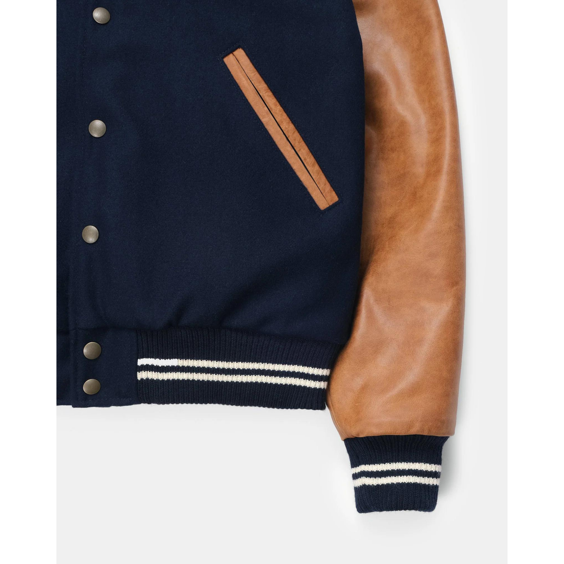 Close-up of navy varsity jacket sleeve and pocket details