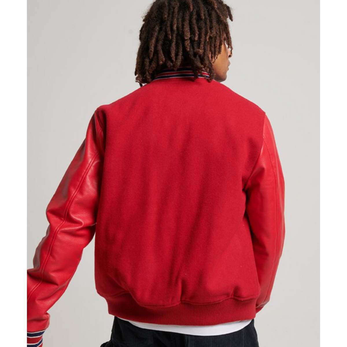 Back view of a red varsity jacket.