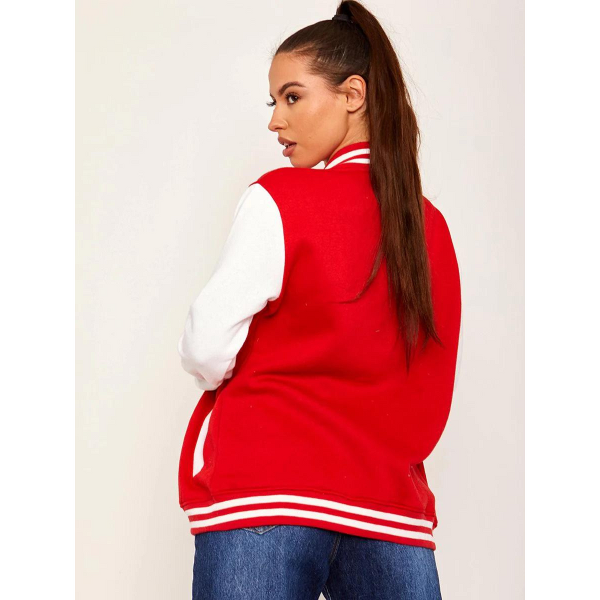 Women's red varsity jacket with white sleeves, back view